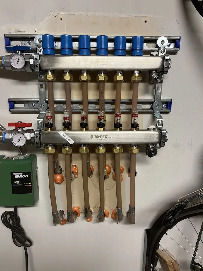 Plumber performing Water Heater Repair at a residential property in Chanhassen